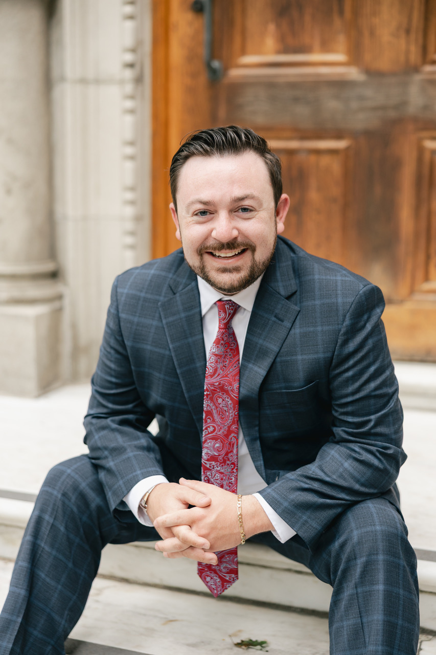 Brad Mushinski seated on stone steps